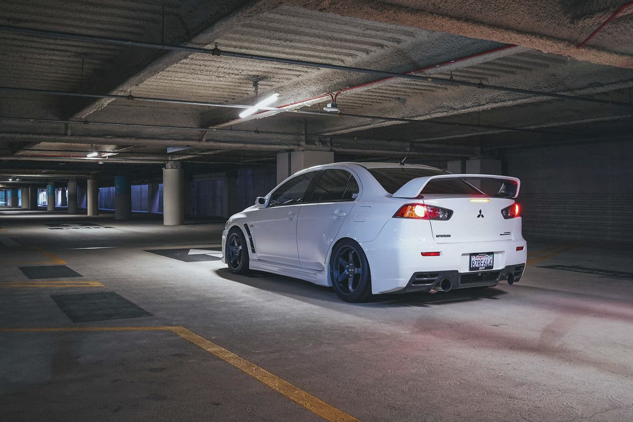 Side profile of 2013 Mitsubishi Evo X with wheels