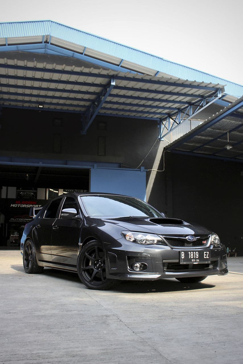 Rear view of 2013 Subaru WRX STI with wheels