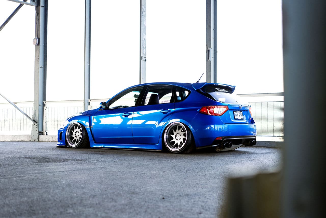 Side profile of 2013 Subaru WRX STI with wheels