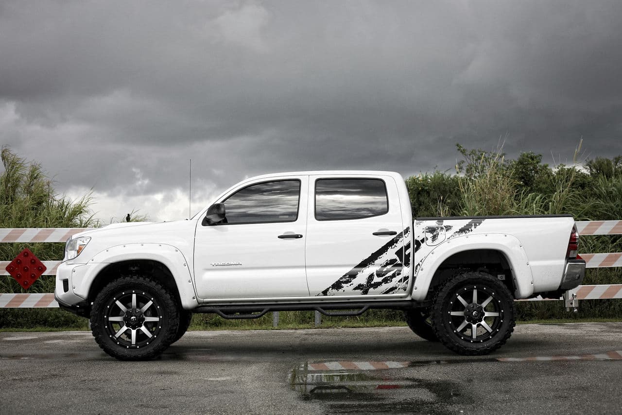 Rear view of 2013 Toyota Tacoma with truck suv wheels
