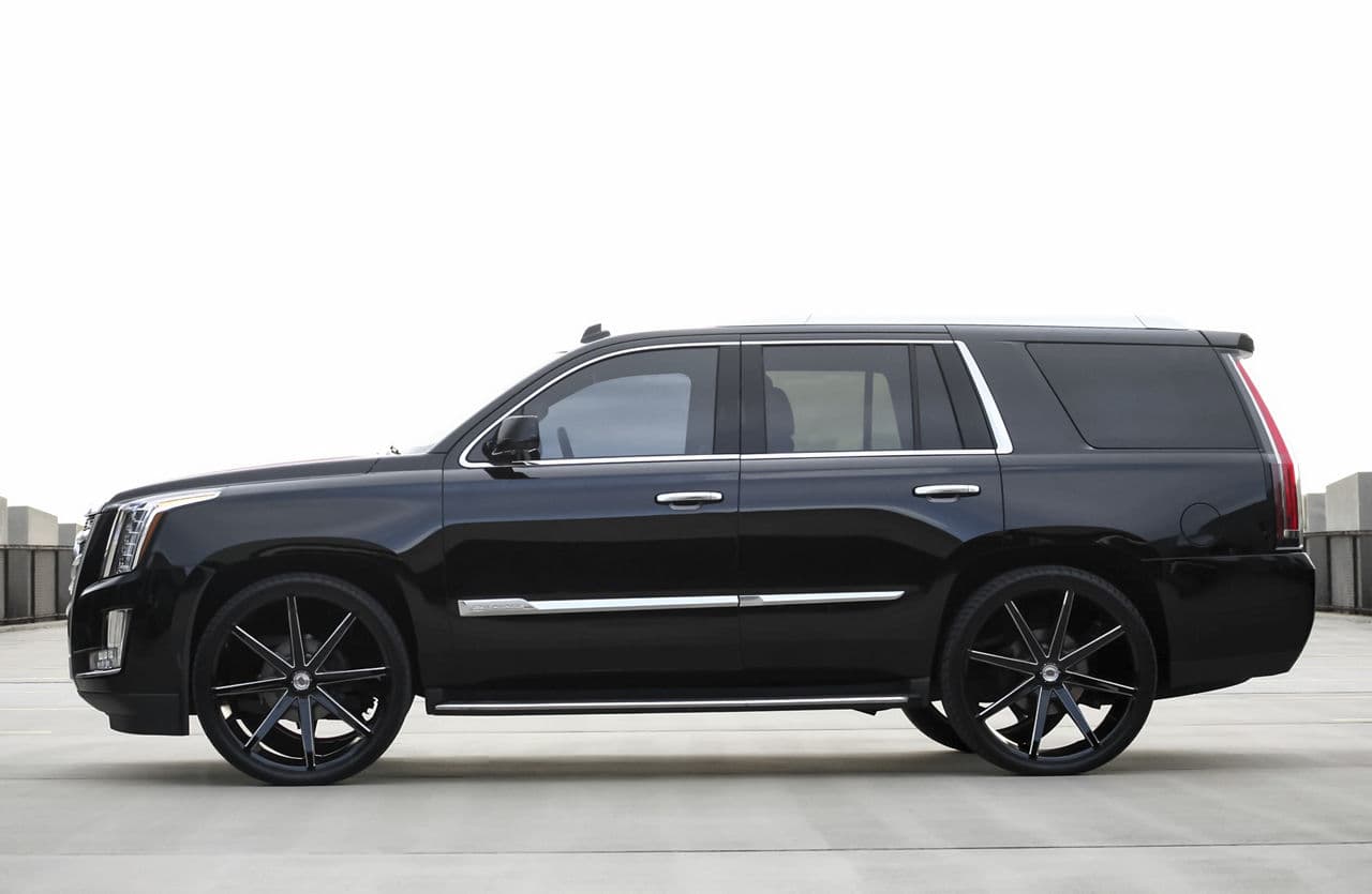 Rear view of 2014 Cadillac Escalade with vehicle wraps