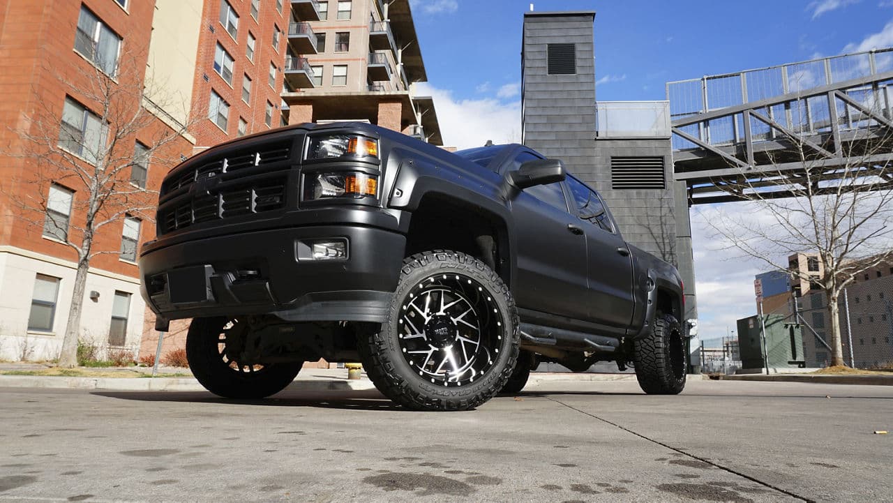 Side profile of 2014 Chevrolet Silverado with wheels