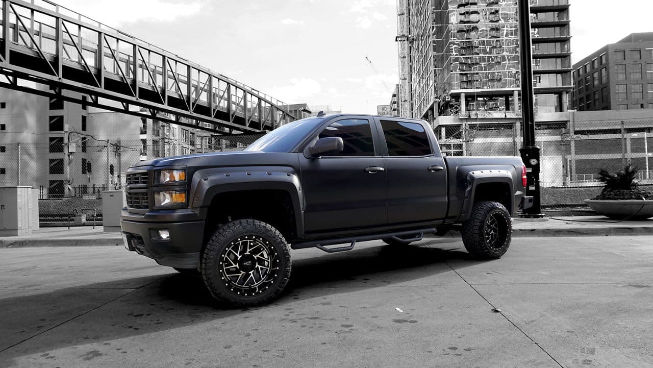 Detail view of 2014 Chevrolet Silverado with wheels