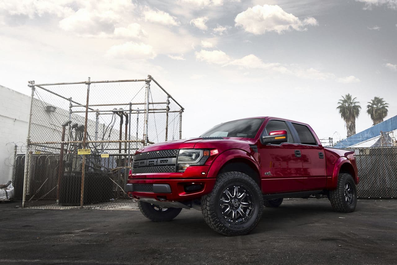 Front view of 2014 Ford F150 Raptor with truck suv wheels