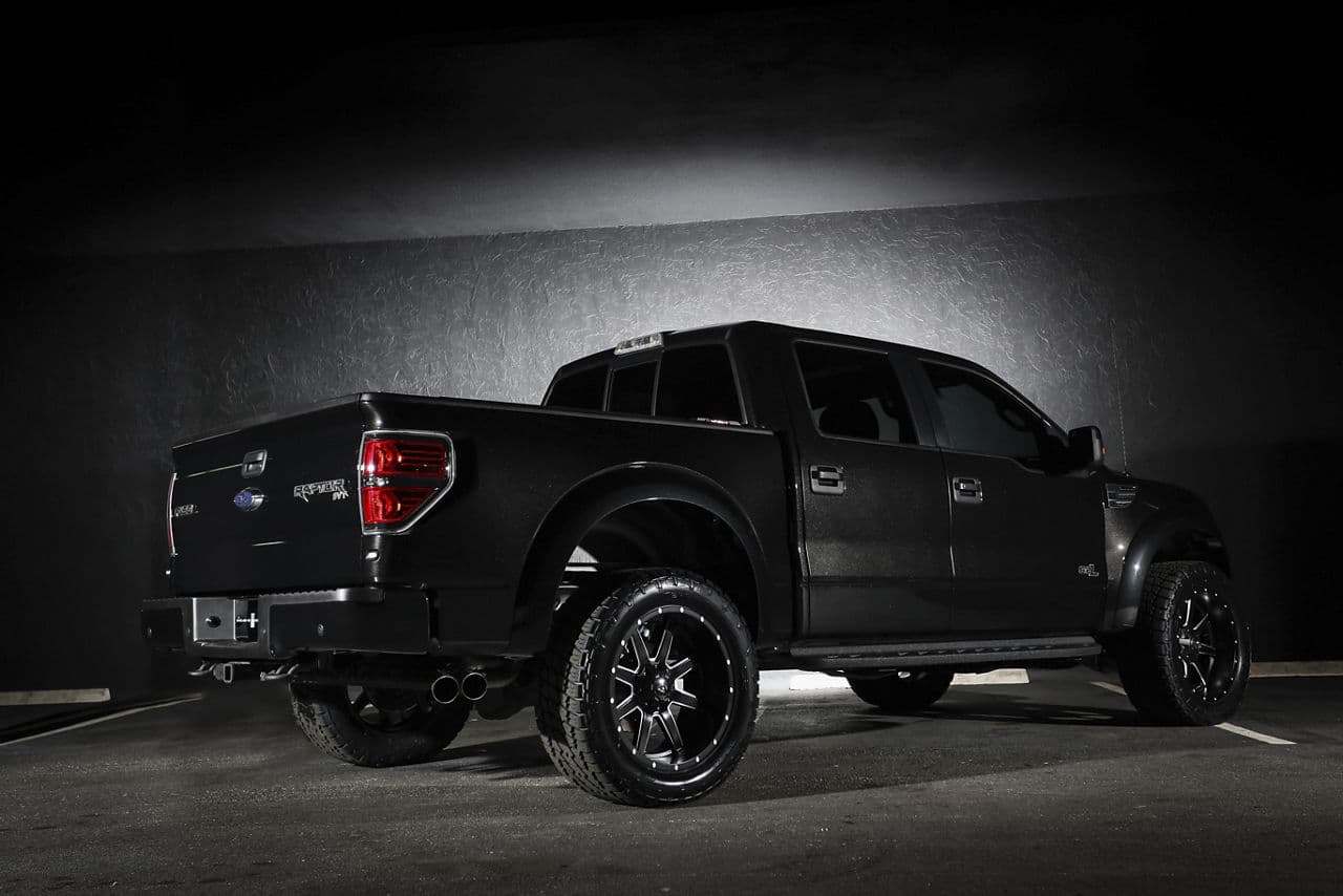 Rear view of 2014 Ford F150 Raptor with wheels