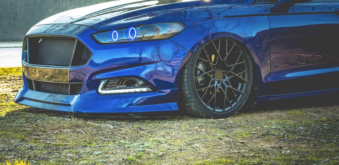 Side profile of 2014 Ford Fusion with wheels