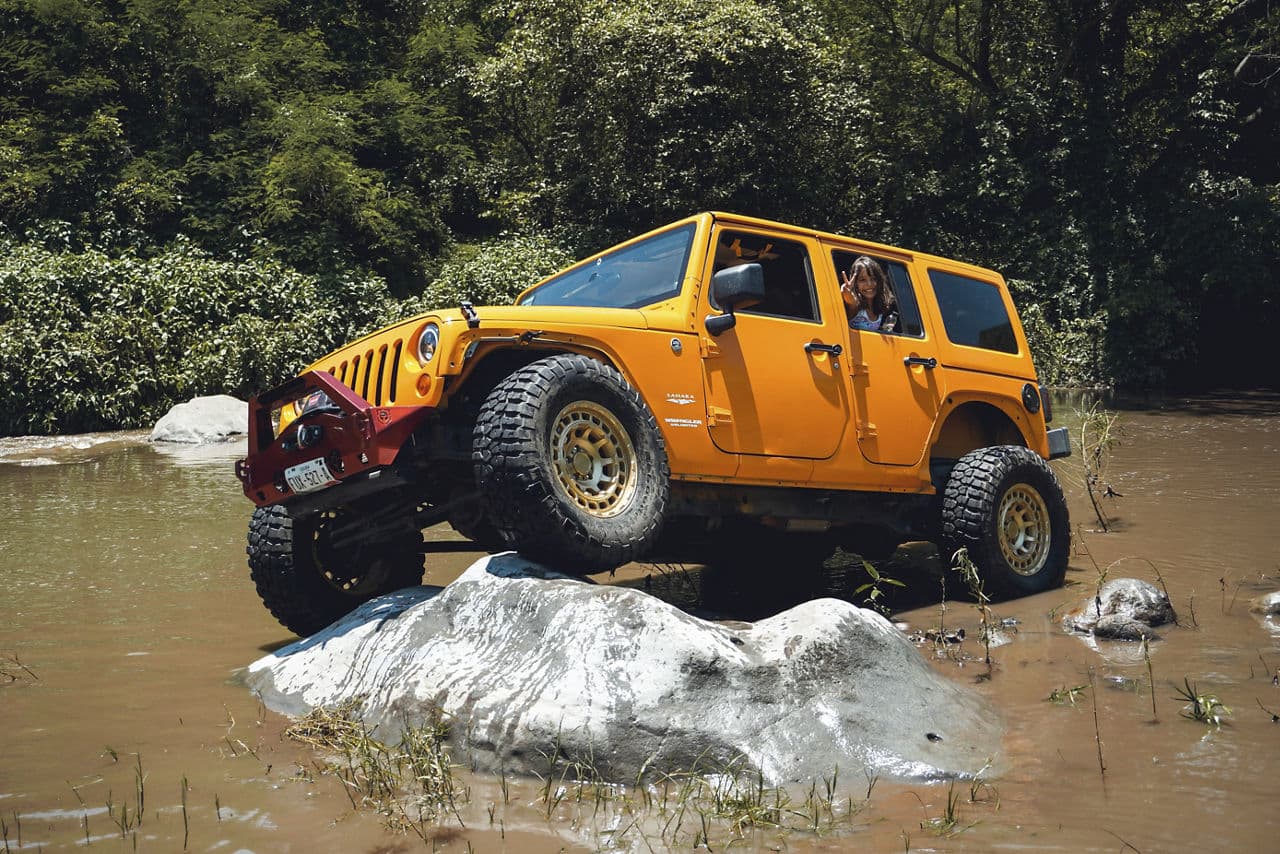 Front view of 2014 Jeep Wrangler with truck suv wheels
