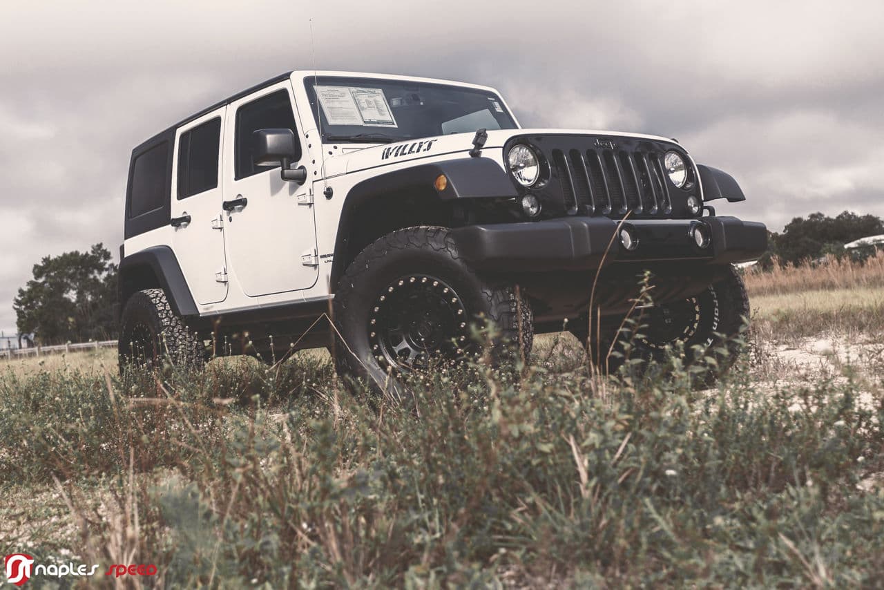 Front view of 2014 Jeep Wrangler Willys with truck suv wheels