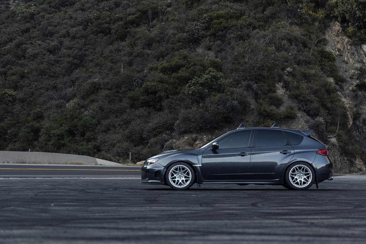 Side profile of 2014 Subaru Impreza WRX with wheels