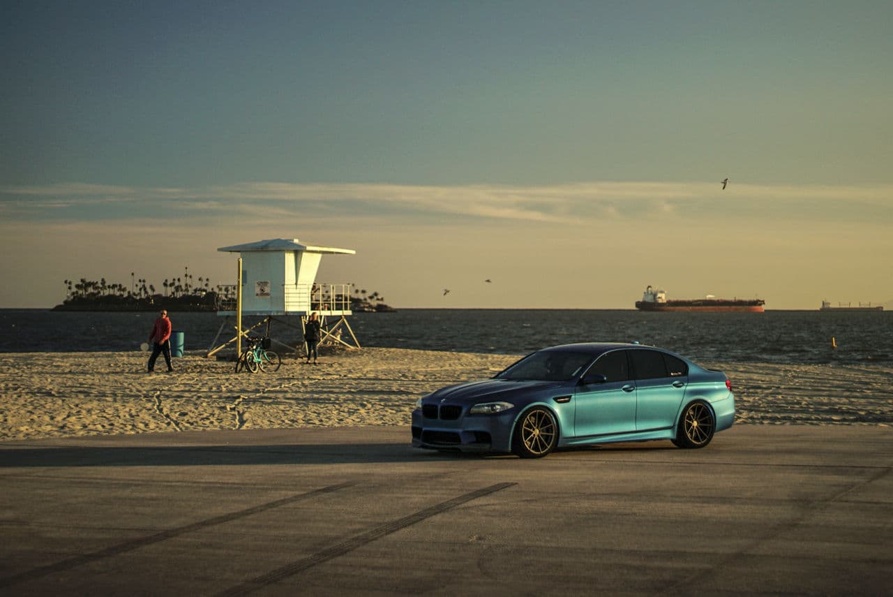 Rear view of 2015 BMW M5 with wheels