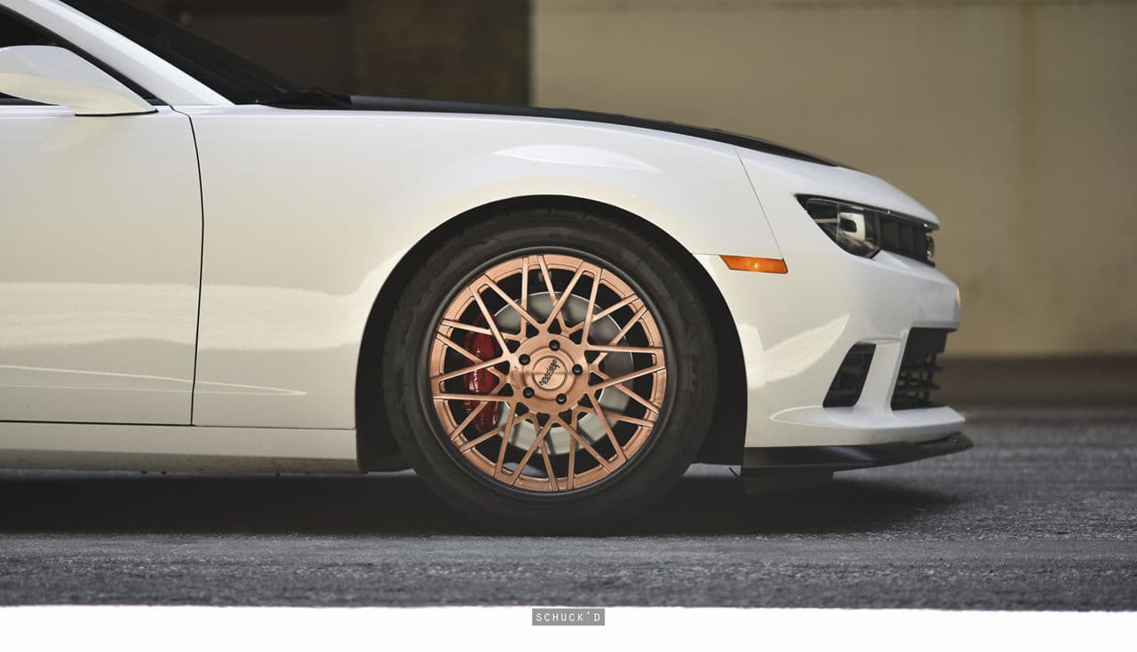 Side profile of 2015 Chevrolet Camaro with wheels
