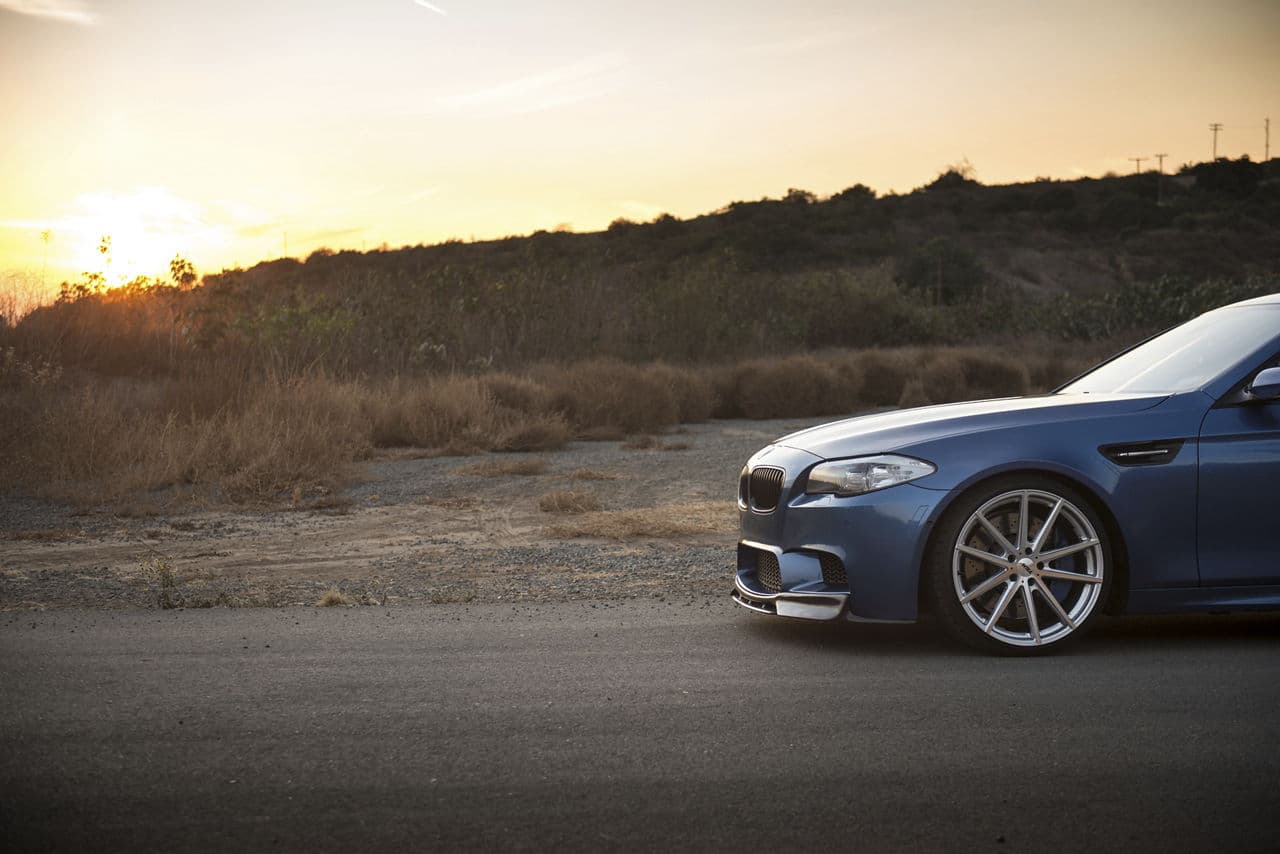 Rear view of 2016 BMW M5 with wheels