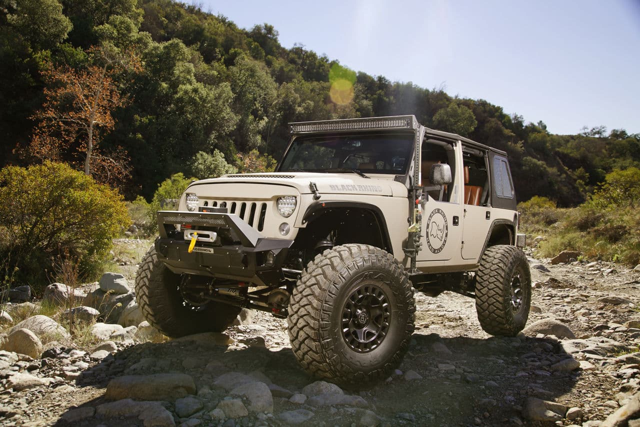 Front view of 2016 Jeep Wrangler with truck and suv wheels
