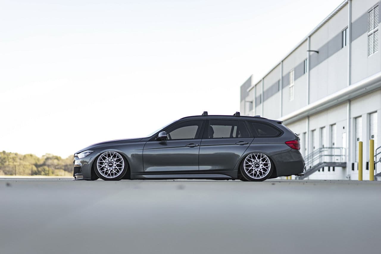 Side profile of 2018 BMW 330i X-Drive with wheels
