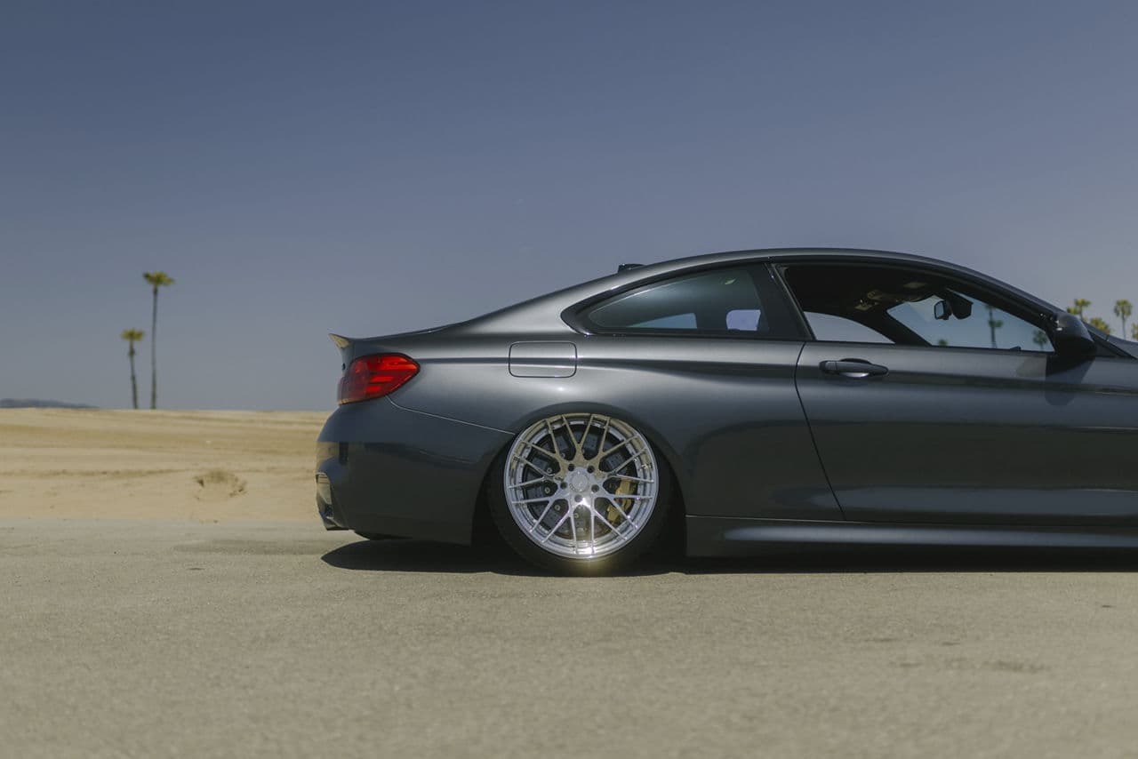 Rear view of 2018 BMW M4 with wheels