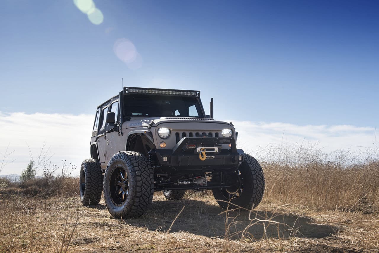 Side profile of 2018 Jeep Wrangler with truck suv wheels