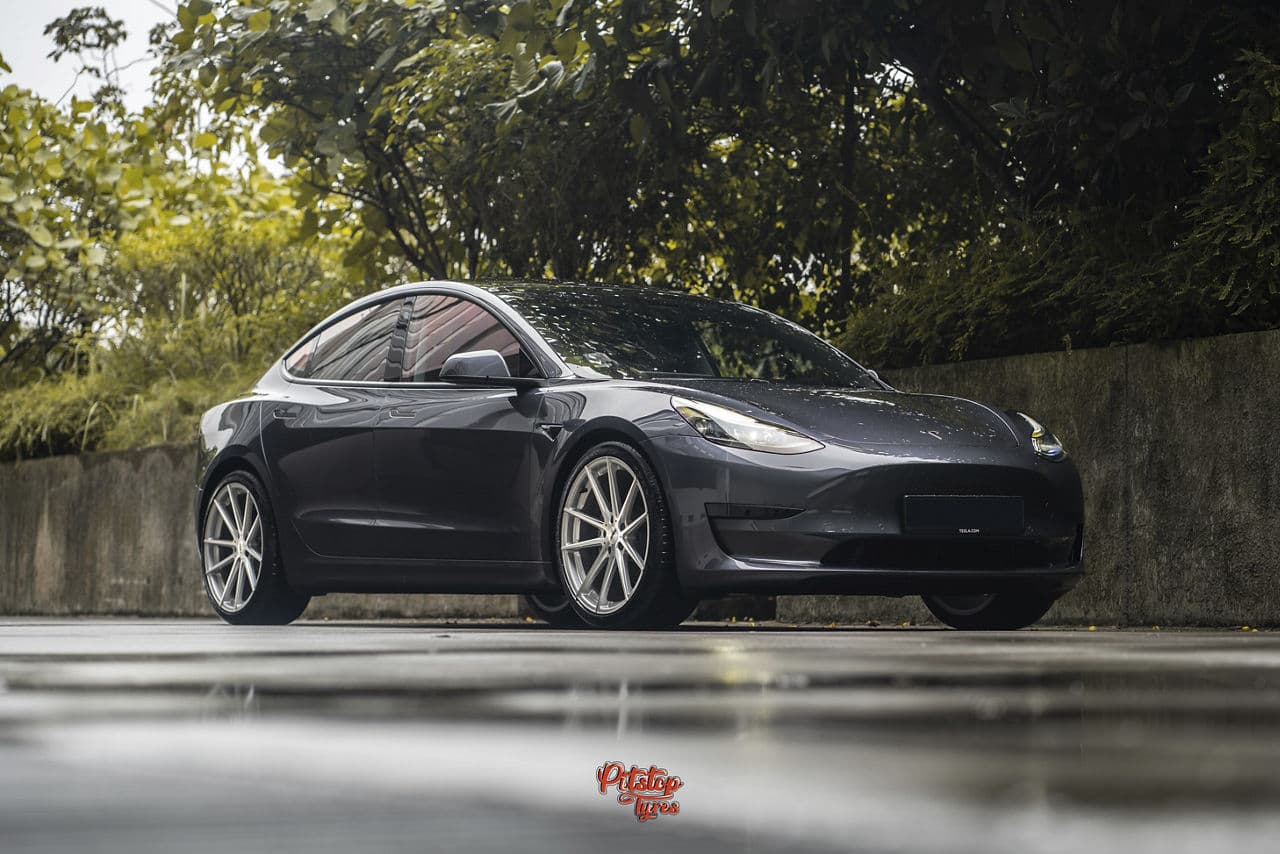 Front view of 2018 Tesla Model 3 with wheels