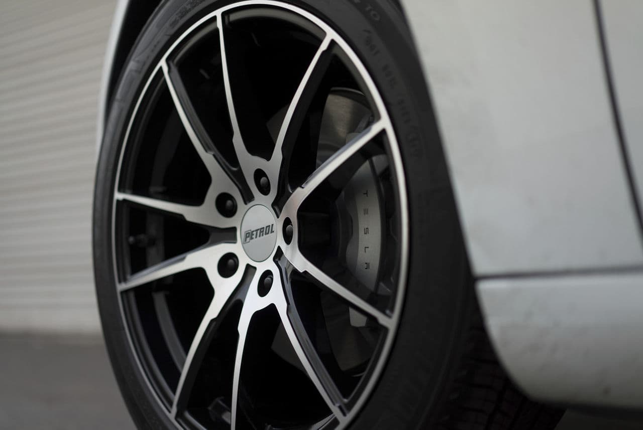 Rear view of 2018 Tesla Model 3 with wheels