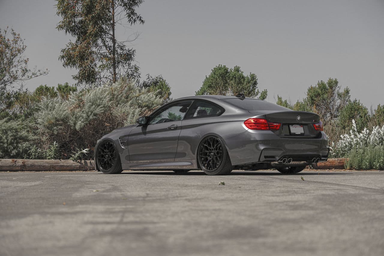 Rear view of 2019 BMW M4 with wheels