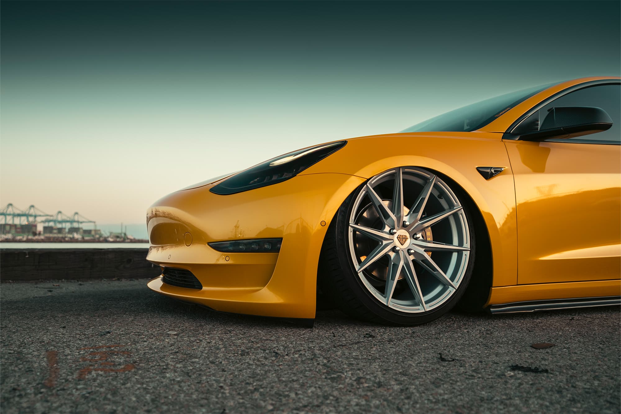 2019 Tesla Model 3 — tuner wheels, rear view