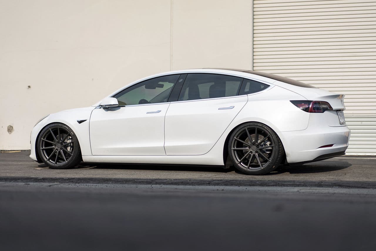 Rear view of 2019 Tesla Model 3 with wheels