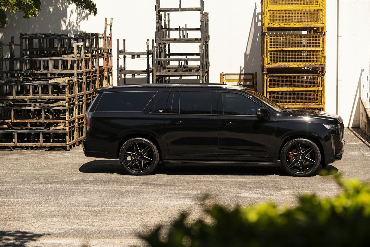 Rear view of 2020 Cadillac Escalade with wheels