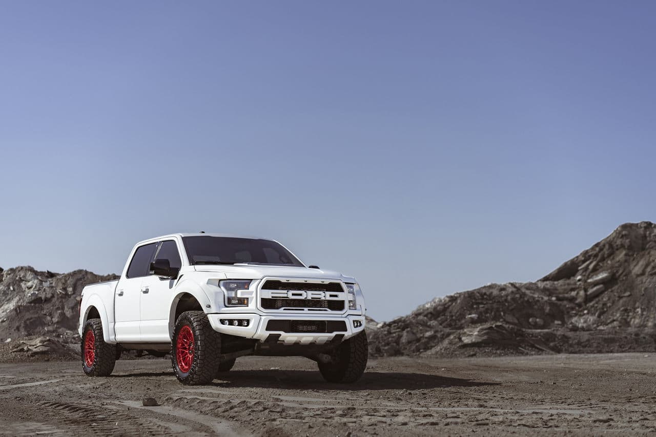 Front view of 2020 Ford F150 Raptor with vehicle wraps