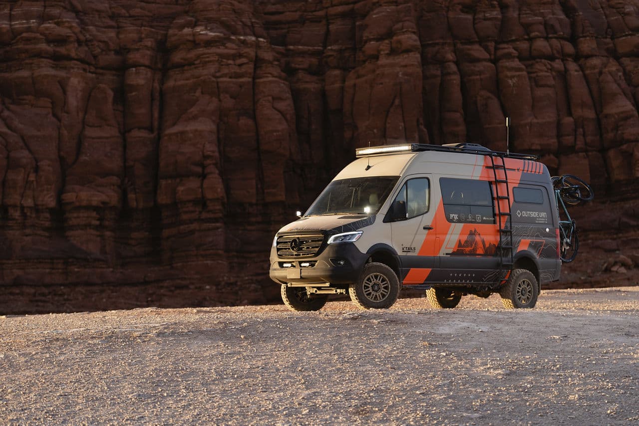 Side profile of 2020 Mercedes-Benz Sprinter with vehicle wraps