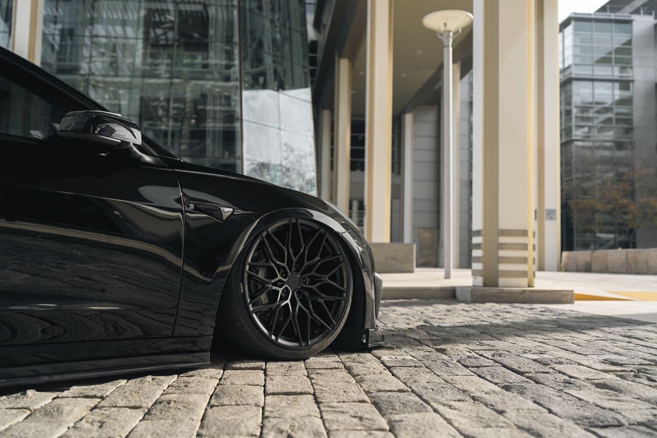 Rear view of 2020 Tesla Model 3 with wheels