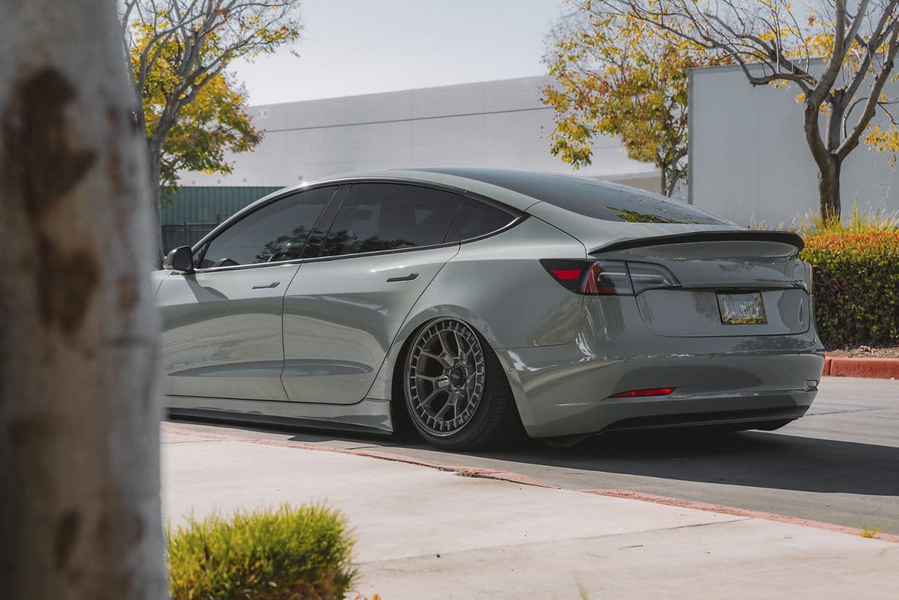 Side profile of 2020 Tesla Model 3 with wheels