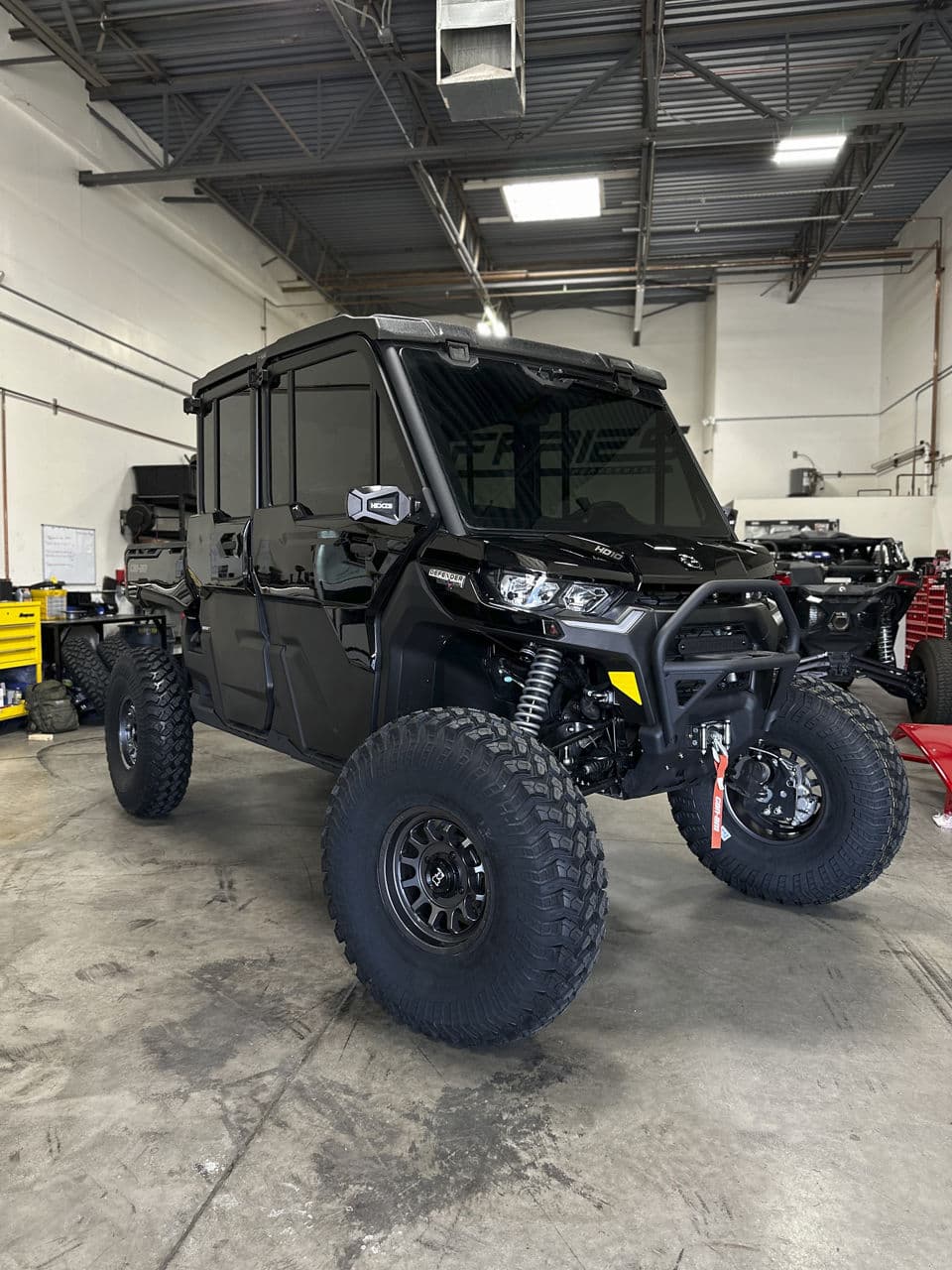 Front view of 2021 CanAm Defender with wheels