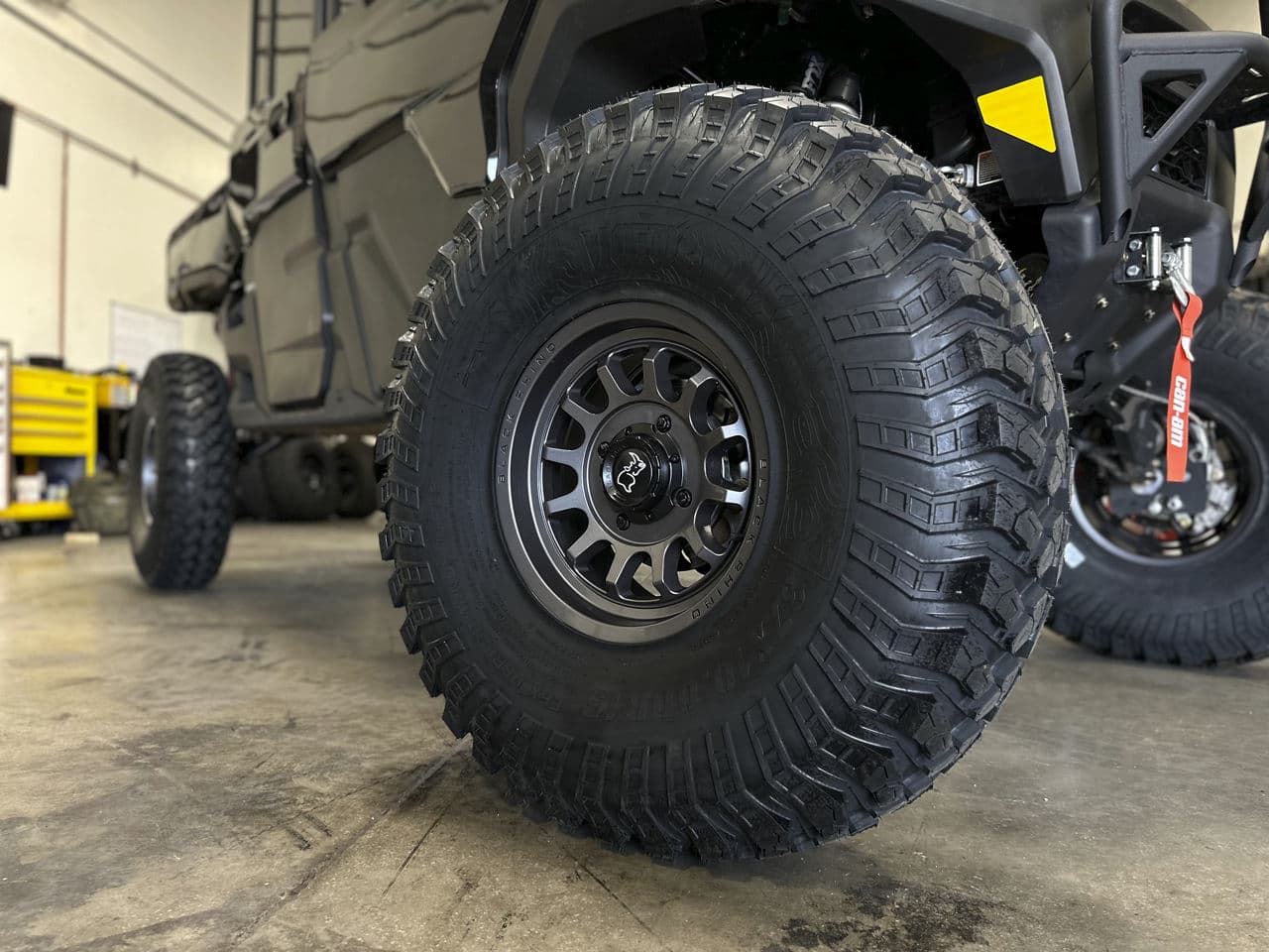 Side profile of 2021 CanAm Defender with wheels