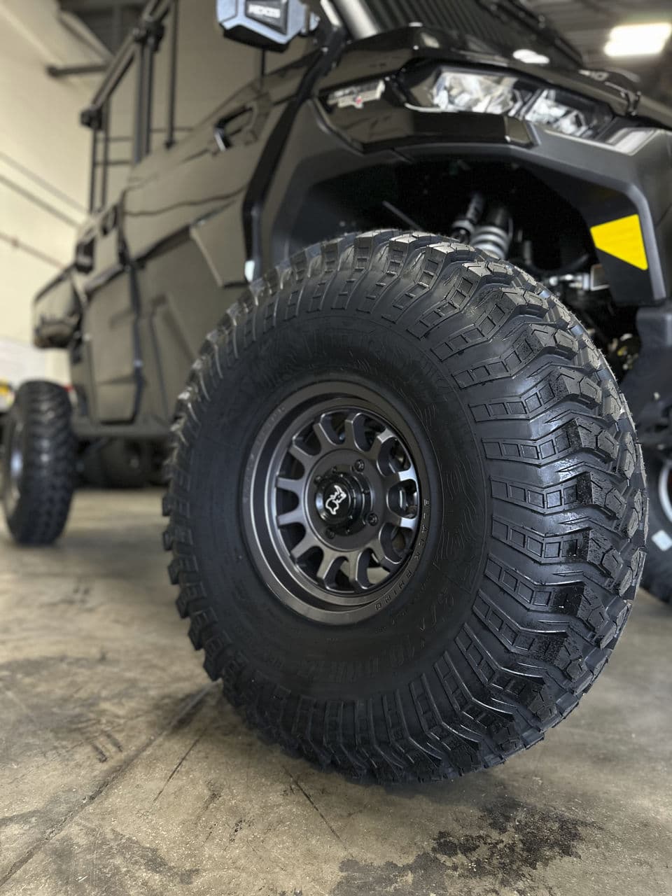 Rear view of 2021 CanAm Defender with wheels