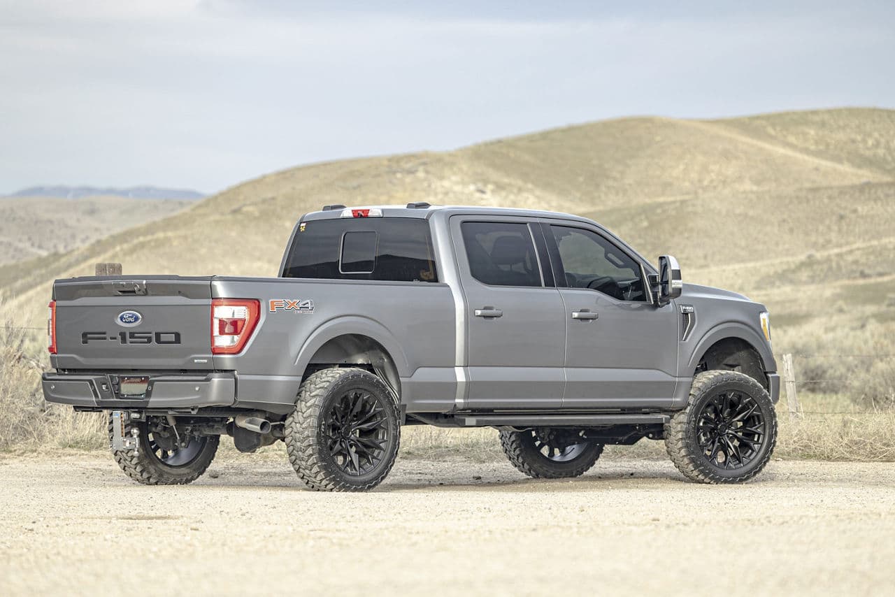 Front view of 2021 Ford F150 Lariat with truck suv wheels