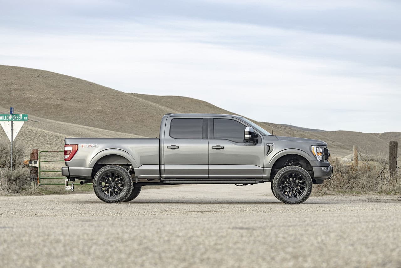 Side profile of 2021 Ford F150 Lariat with truck suv wheels