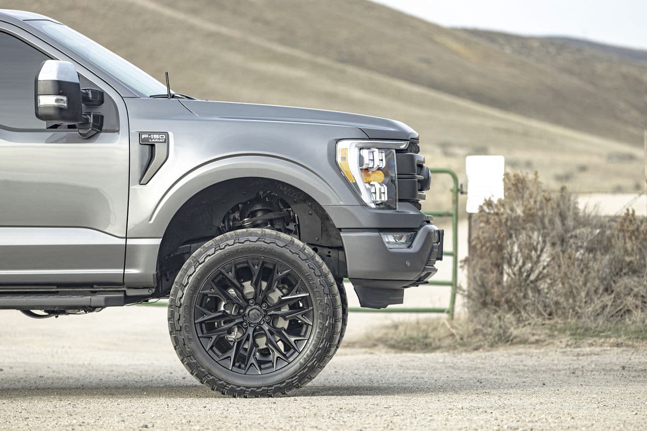 Detail view of 2021 Ford F150 Lariat with truck suv wheels