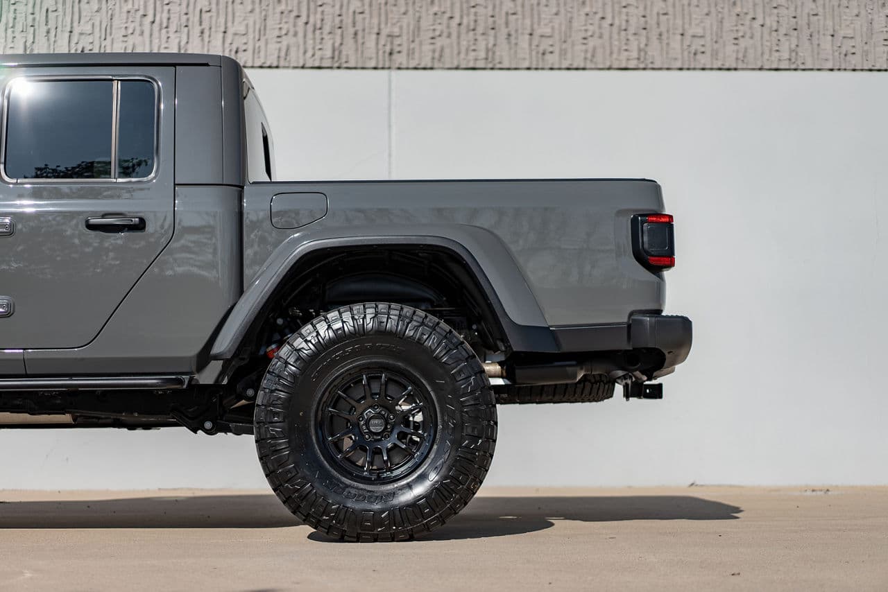 Rear view of 2021 Jeep Gladiator Mojave with wheels