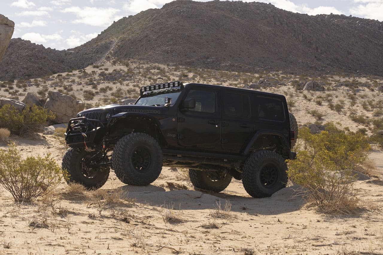 Side profile of 2021 Jeep Wrangler with custom wheels and tires