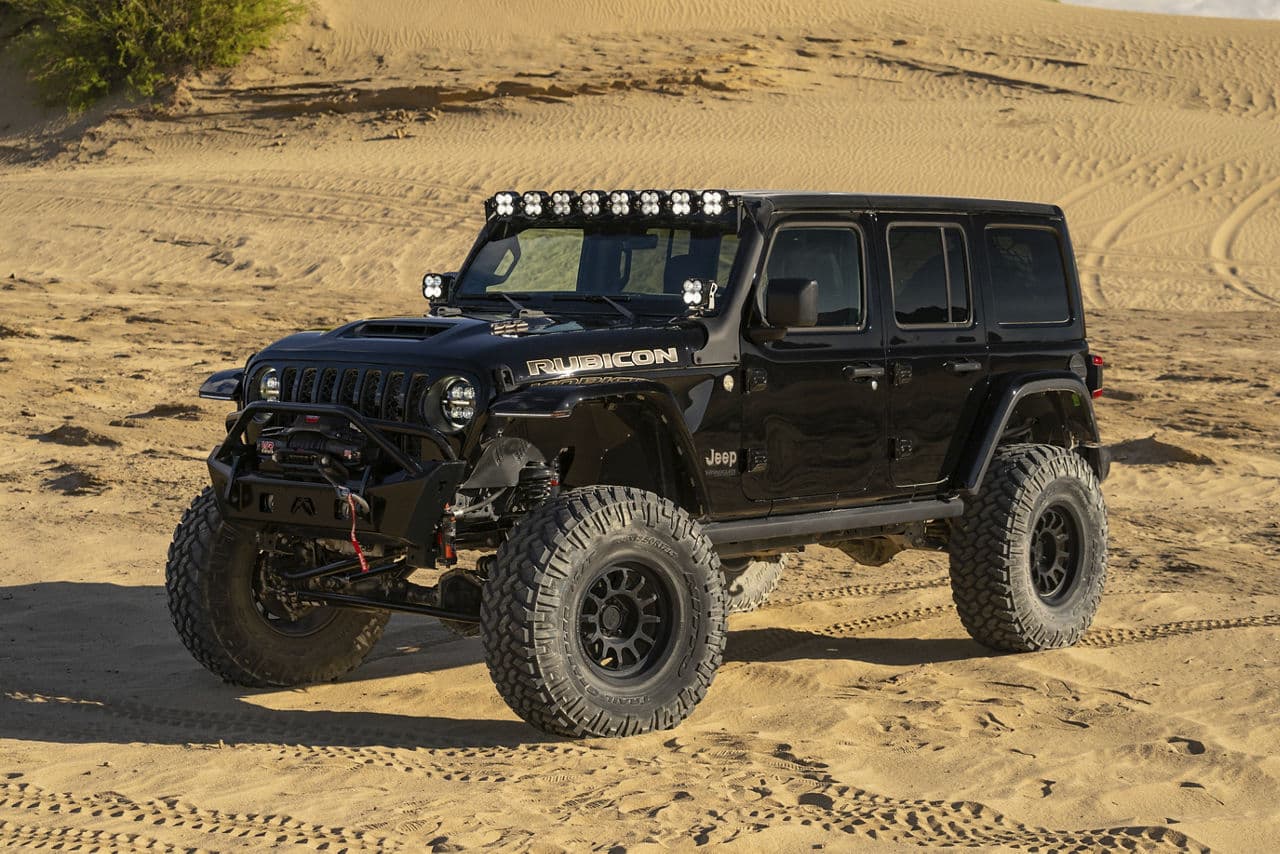 Rear view of 2021 Jeep Wrangler with custom wheels and tires