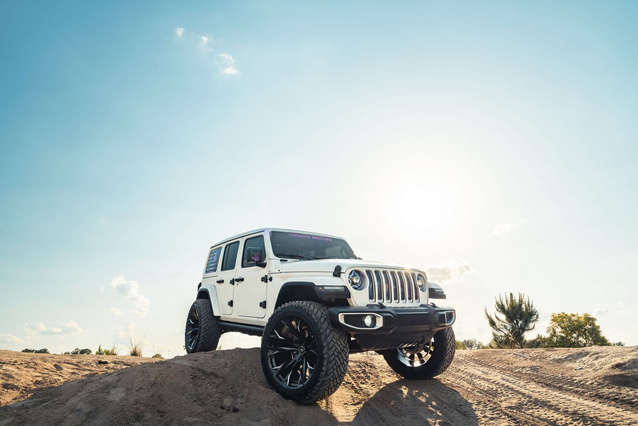Front view of 2021 Jeep Wrangler with truck suv wheels