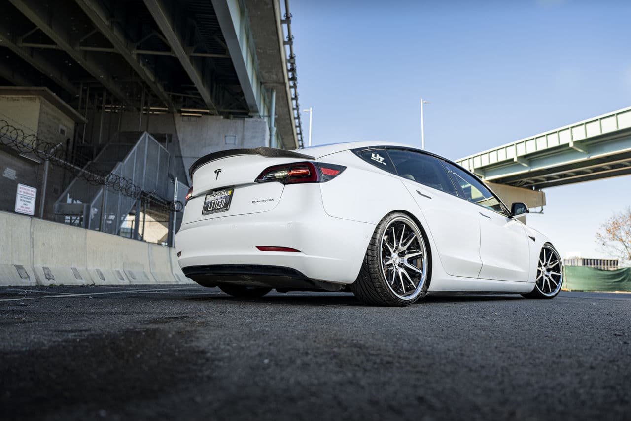 Rear view of 2021 Tesla Model 3 with wheels