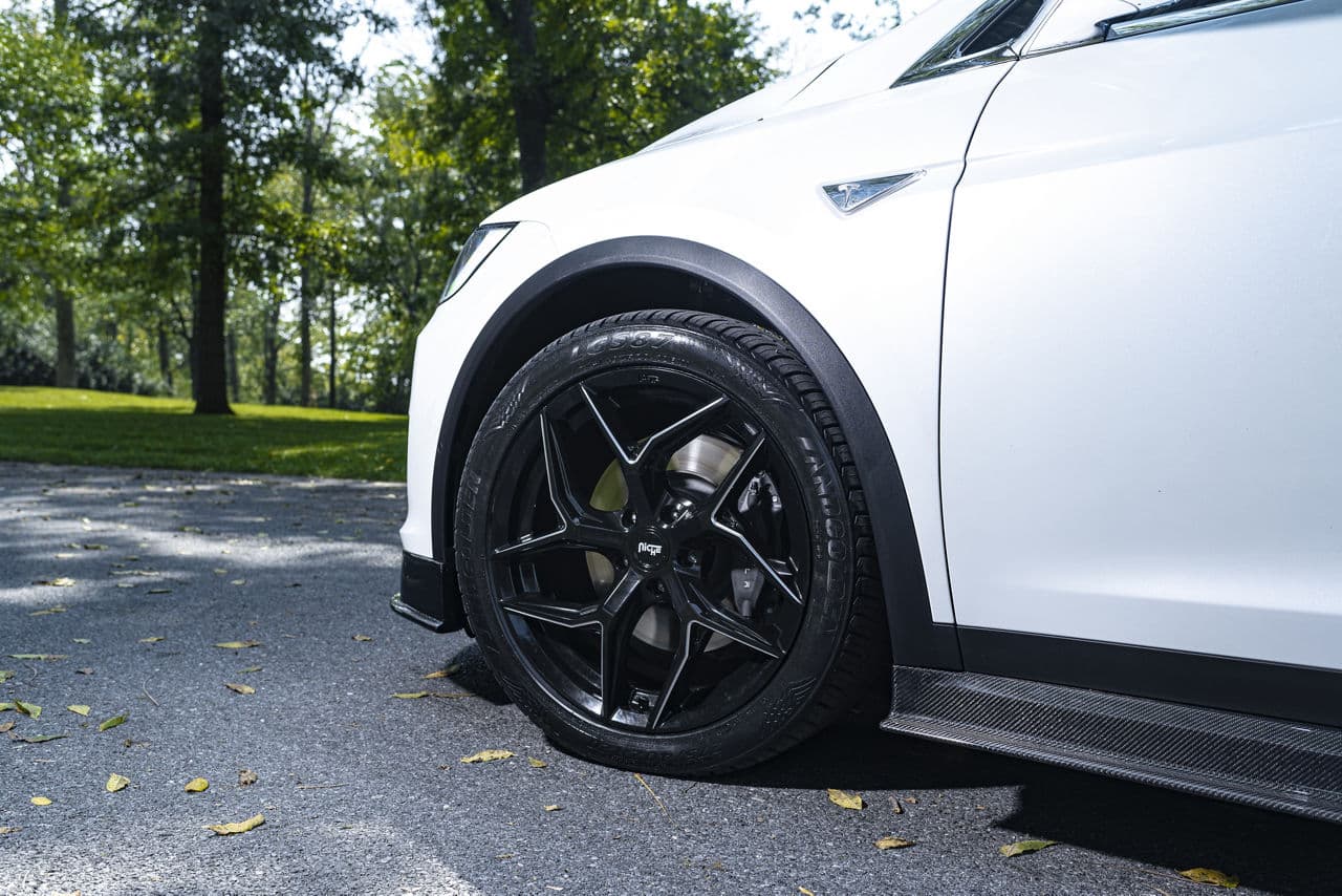 Side profile of 2021 Tesla Model X with wheels