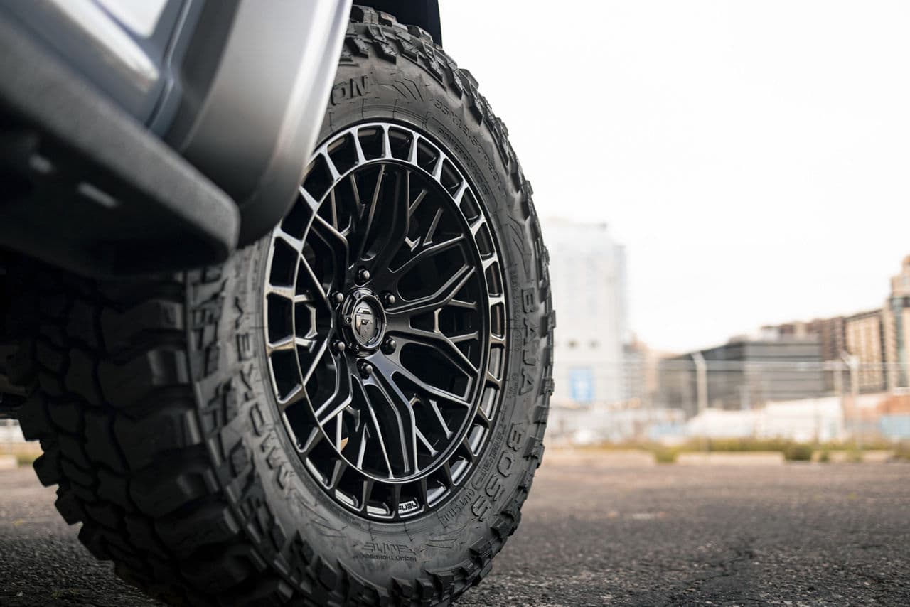 Detail view of 2022 Ford F150 Raptor with truck suv wheels