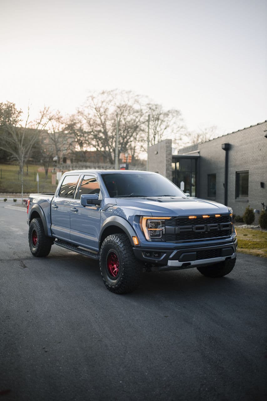 Front view of 2022 Ford F150 Raptor with truck suv wheels