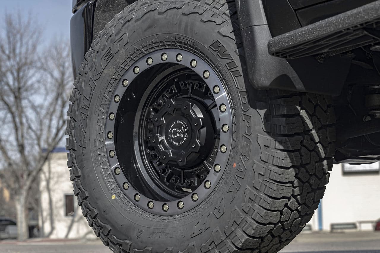 Detail view of 2022 GMC Sierra AT4 with truck suv wheels