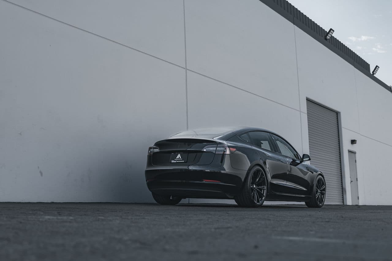 Rear view of 2022 Tesla Model 3 with wheels