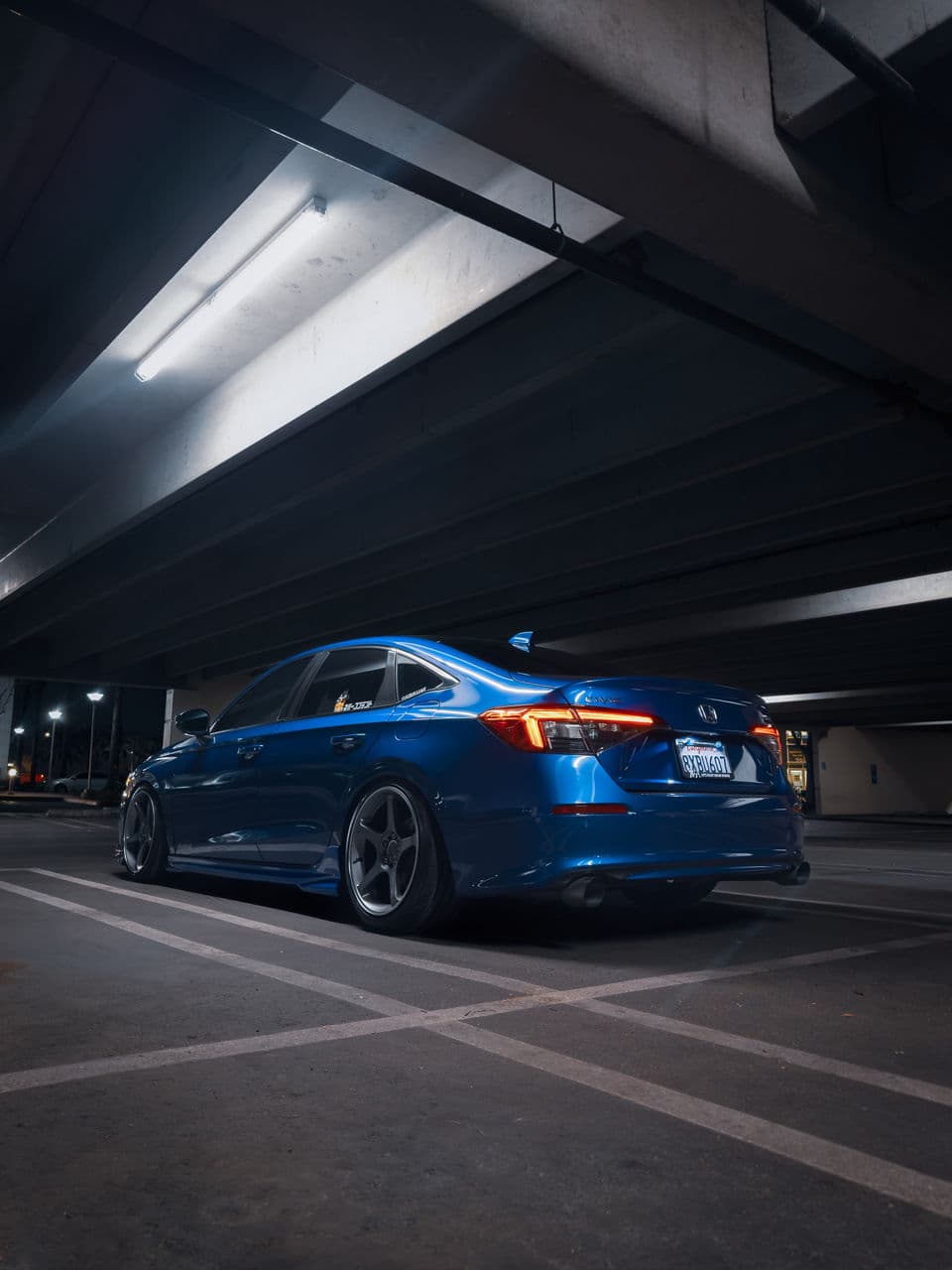 Rear view of 2023 Honda Civic with wheels