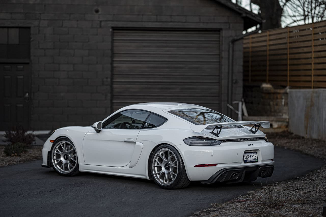 Side profile of 2023 Porsche 718 GT4 with wheels