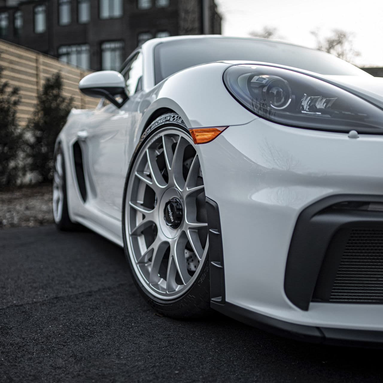 Detail view of 2023 Porsche 718 GT4 with wheels