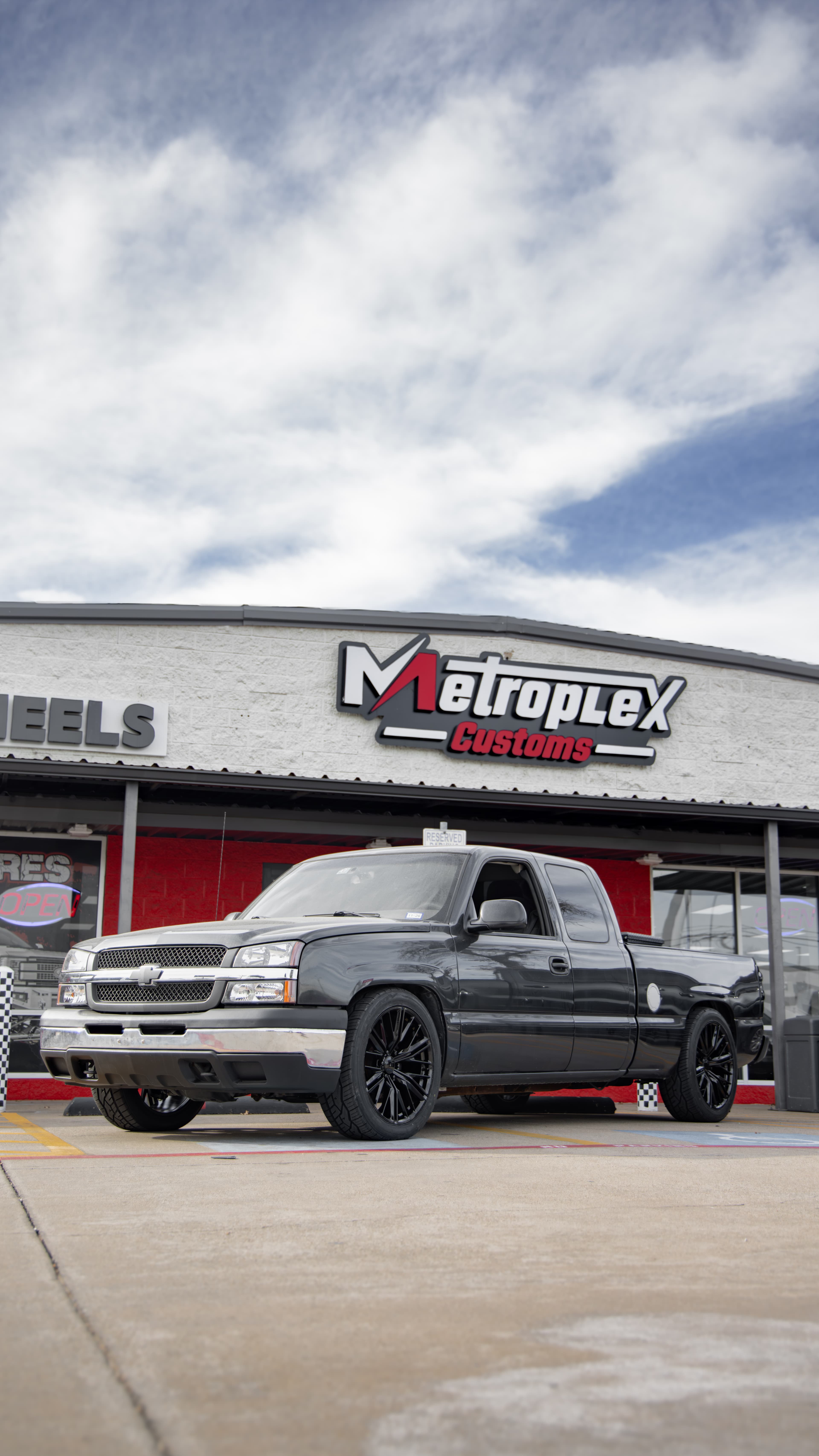 Precision drop kit installation with coilover conversion at Metroplex Customs in Irving, TX